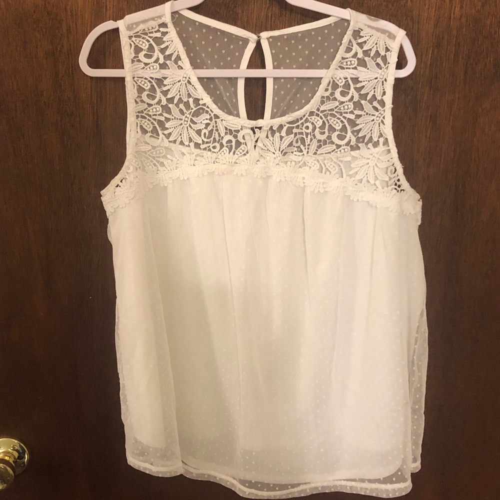 Maurice’s white tank top